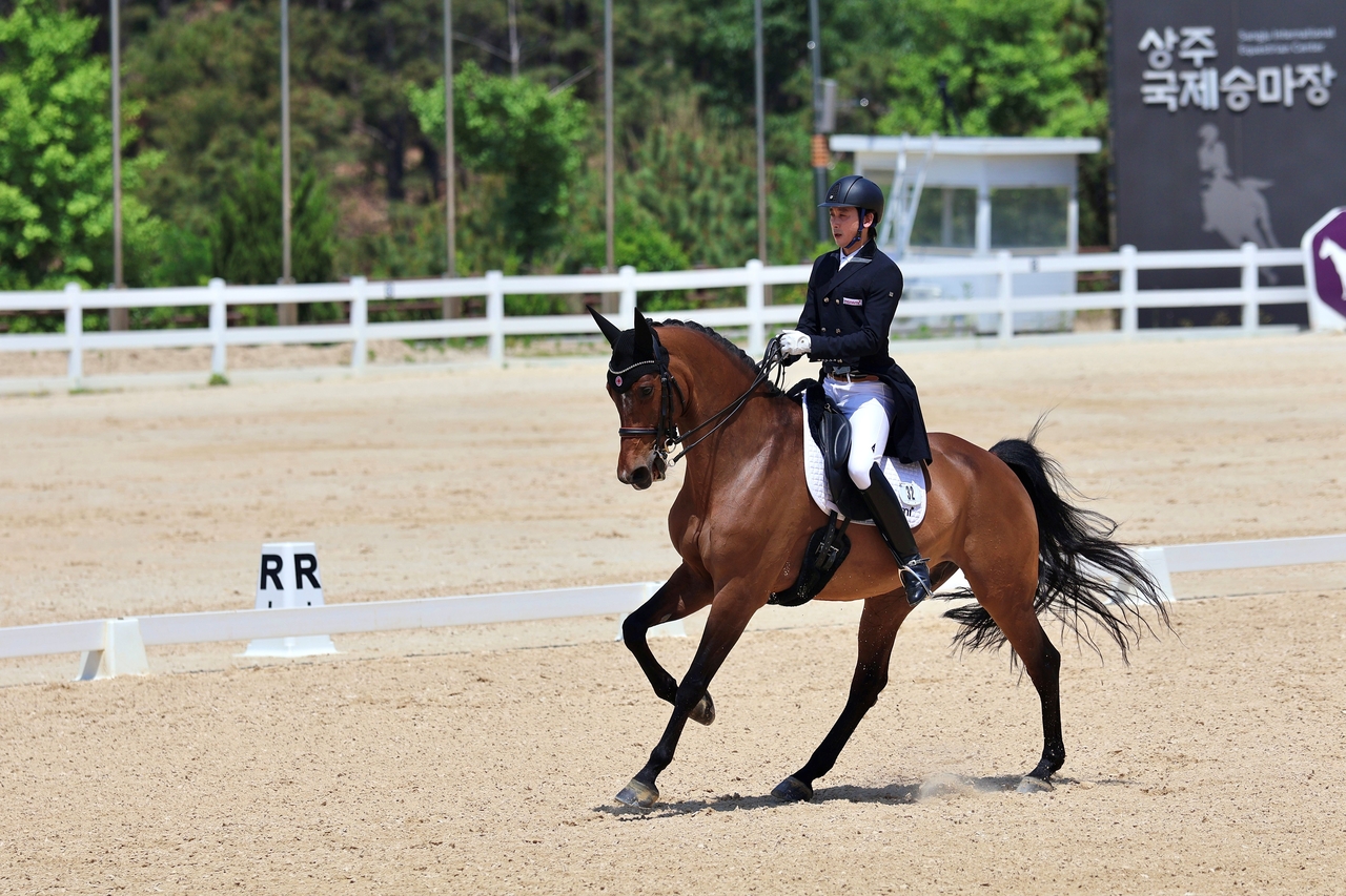 South Korea’s Nam Dong-heon competes with his horse Leonidas in the individual dressage final at the 2026 Aichi-Nagoya Asian Games at Tokyo Equestrian Park in Tokyo on Sunday. (Yonhap)