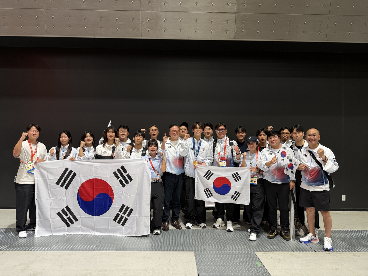 Kang Jun-i of South Korea poses for a photo with officials from the Korean Roller Sports Federation after winning gold in the men's street skateboarding event at the 2026 Aichi-Nagoya Asian Games at Aichi Sky Expo in Tokoname, Aichi Prefecture, Japan, on Sunday. [Korean Roller Sports Federation]