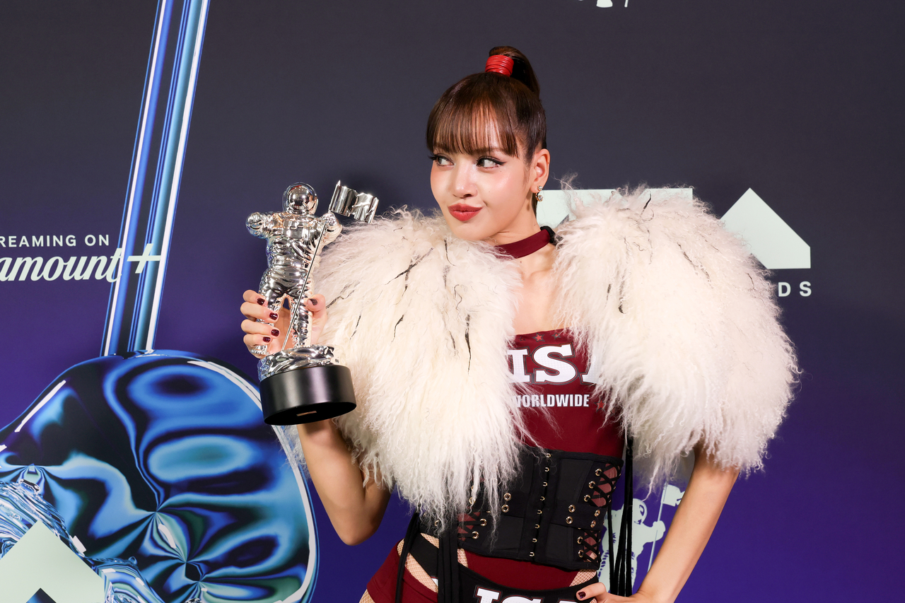 Lisa poses with her best pop award in the press room during the 2026 MTV Video Music Awards at Peacock Theater on Sunday in Los Angeles. (Getty Images)