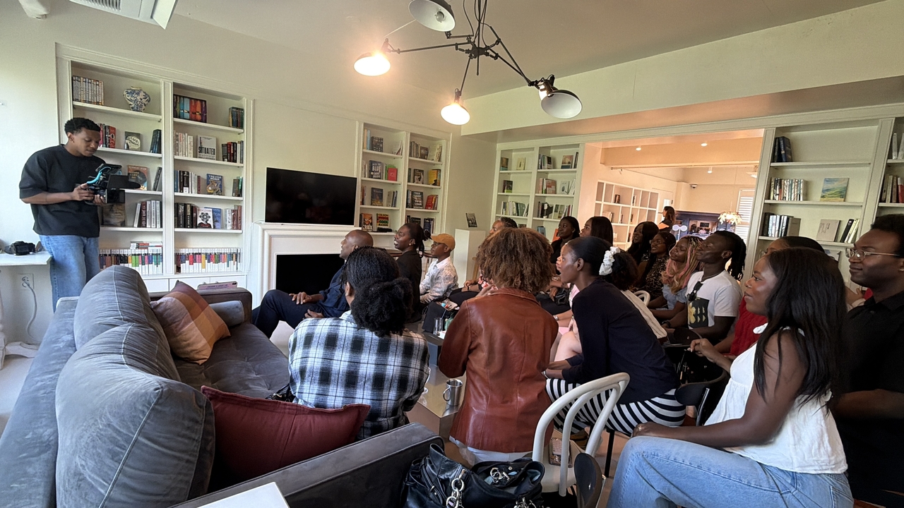 Participants pose as photographer Tim Baso captures the moment during the first meeting of the group Black Seoul Creatives at a cafe in Mapo-gu on Sept. 20. (Park Ga-young/The Korea Herald)