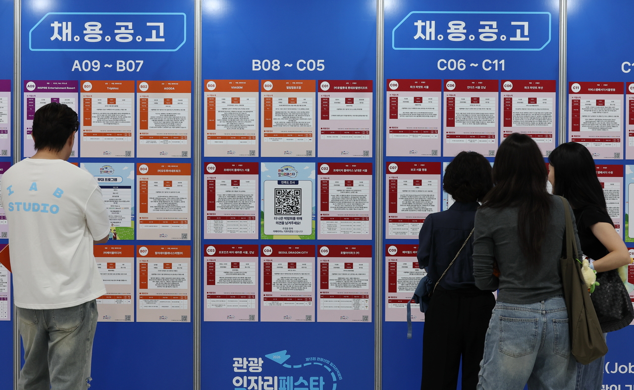 Job seekers check recruitment postings at the 2026 Tourism Job Festa held at the aT Center in Seocho-gu, Seoul, on Friday.