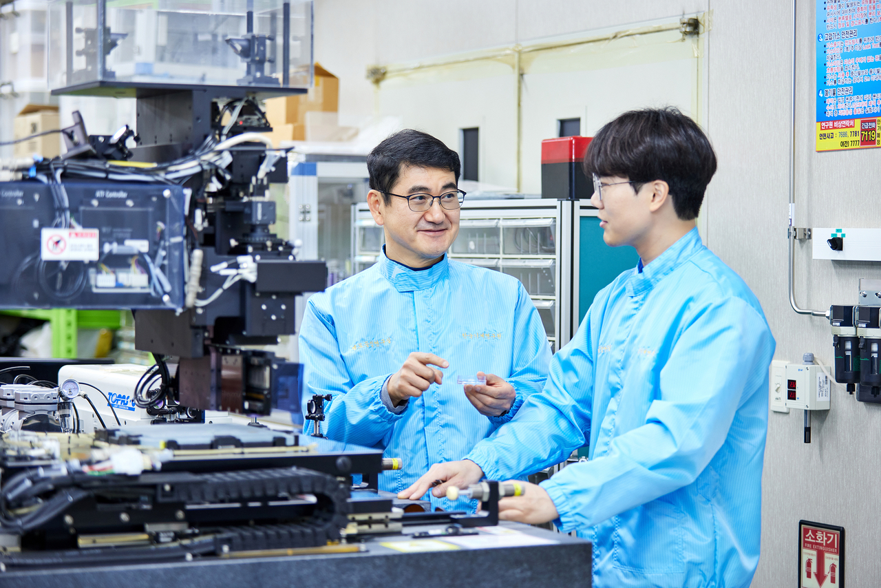 A professor and student conduct research at a UST campus school. [Provided by UST]