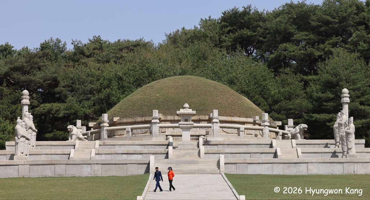 Two visitors walk before the royal tomb of Wang Kon, founder of Goryeo, in Kaesong, North Korea. (Hyungwon Kang)