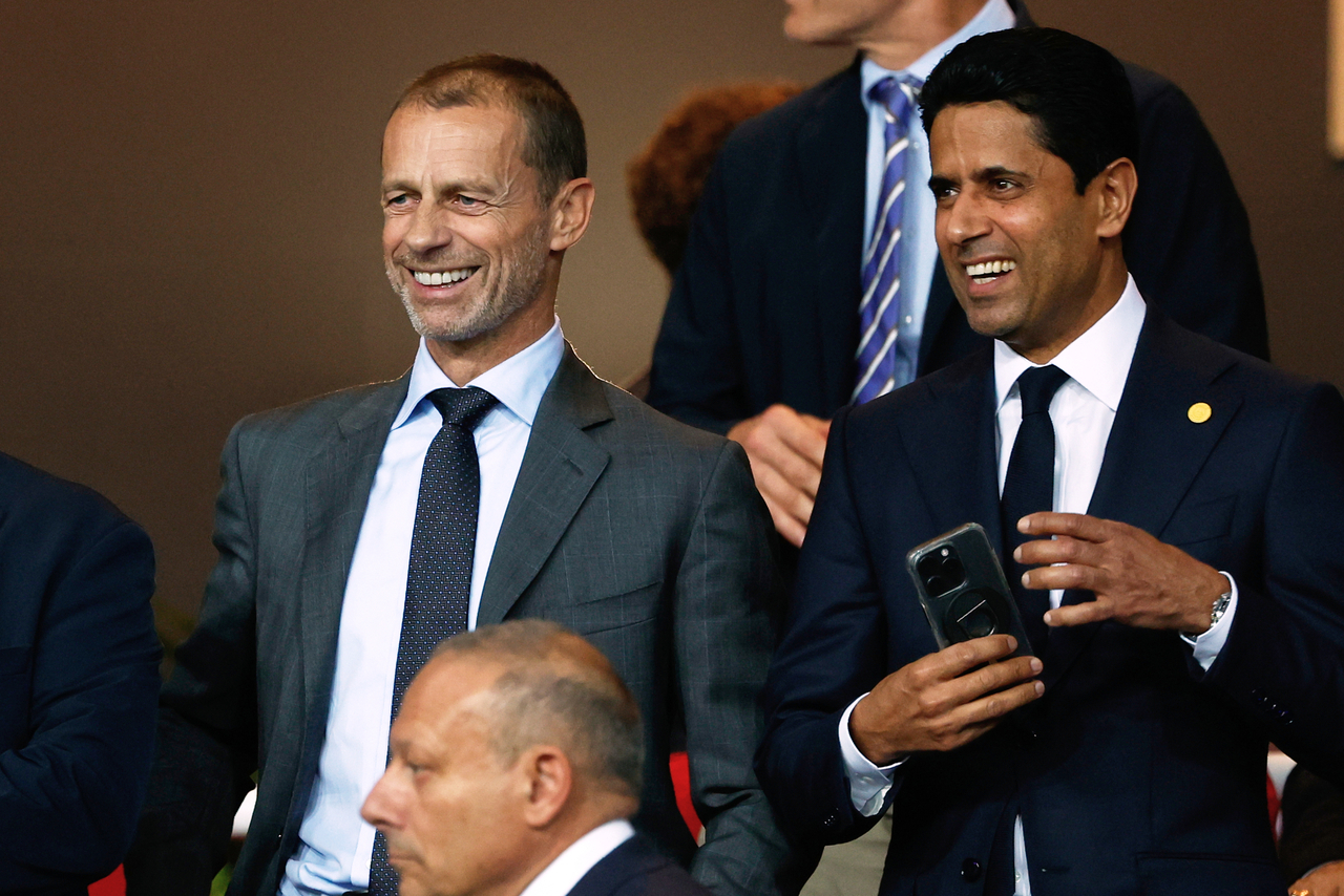 UEFA President Aleksander Ceferin (left) and Paris Saint-Germain Nasser Al-Khelaifi at the stands, prior to the Champions League opening match between Barcelona and Paris Saint-Germain, in Barcelona, Spain, Oct. 1, 2025.    (AP-Yonhap)