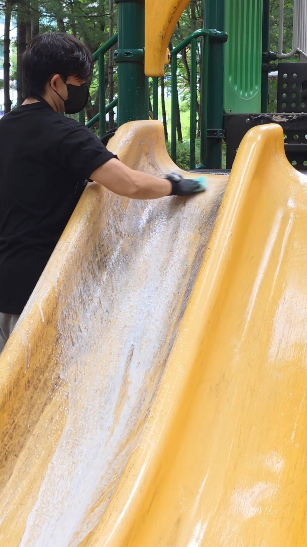 Cho Hee-jae cleans a slide at a playground. (Cho Hee-jae)