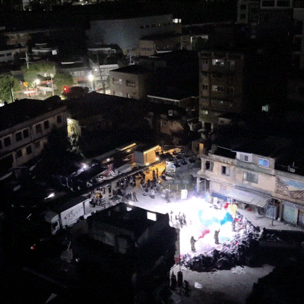 A video taken by a nearby resident shows what appears to be a music video shoot at the Jemulpo Market in Incheon at around 3 a.m. Wednesday. (Threads)