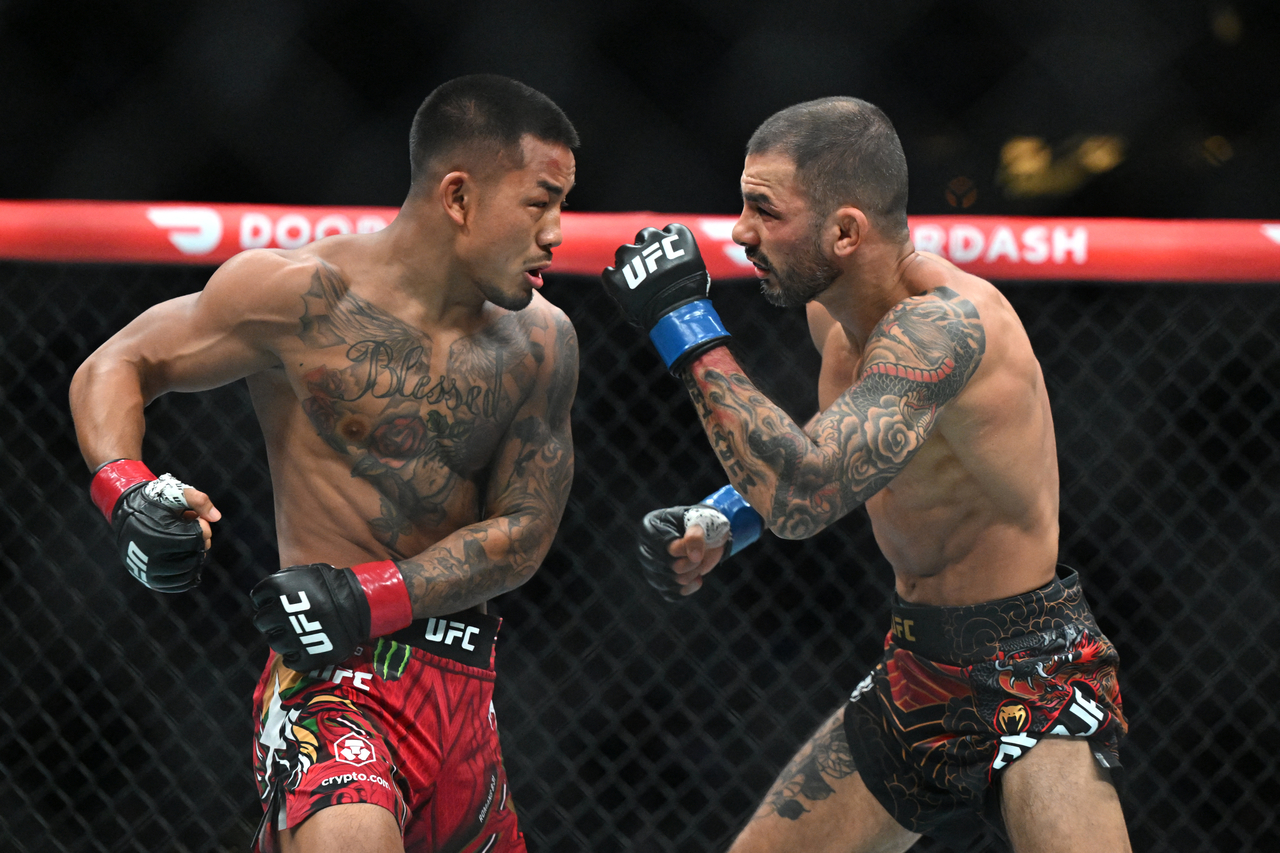 UFC flyweight champion Joshua Van (left) fights Alexandre Pantoja at UFC 331 in Los Angeles on Sept. 19. [Imagn Images]