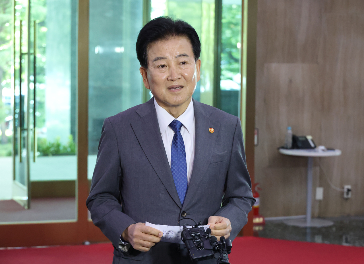 Unification Minister Chung Dong-young speaks to reporters during a brief press availability upon arriving for work at the ministry headquarters in Seoul on Friday. (Yonhap)