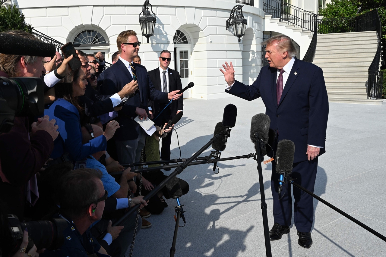 US President Donald Trump speaks to the media before walking to board Marine One as he departs from the South Lawn of the White House in Washington, DC, on Friday. Trump is traveling to Mobile, Alabama to speak at a midterm campaign rally. (AFP-Yonhap)