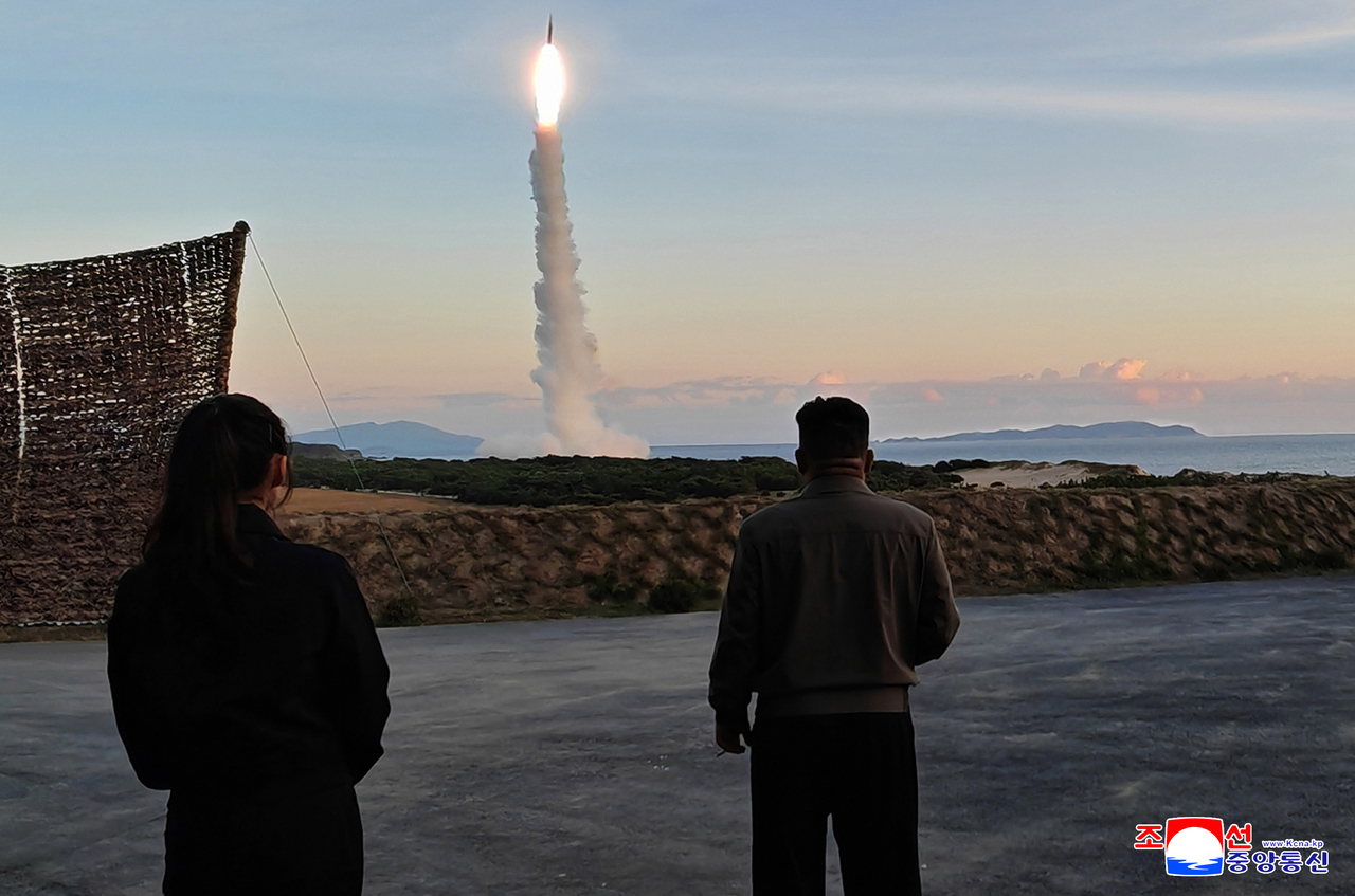 This photo, carried by North Korea's official Korean Central News Agency on Oct. 4, 2026, shows the North firing an intermediate-range strategic missile the previous day, overseen by its leader Kim Jong-un. (Yonhap)