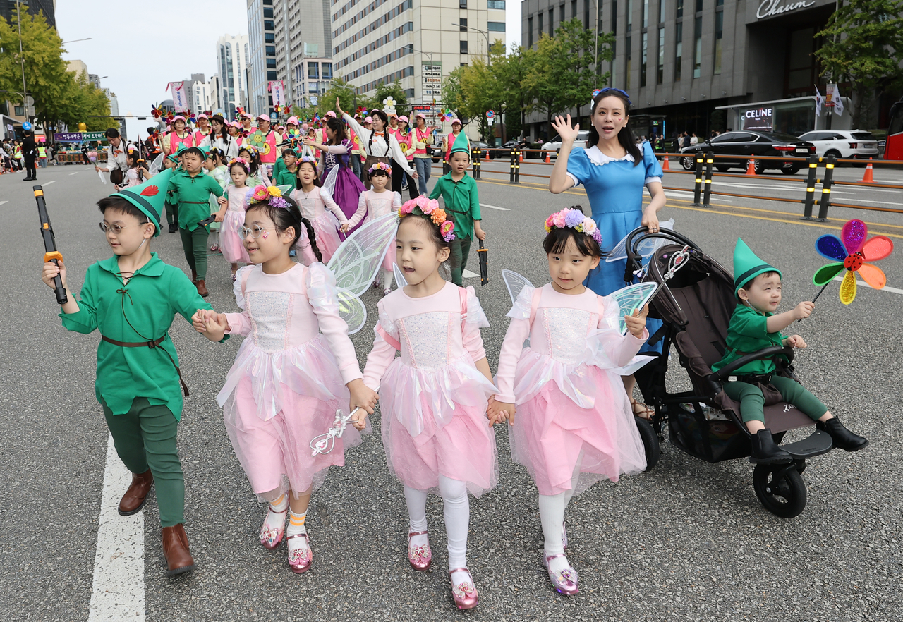 Children dressed as Peter Pan and Tinker Bell take part in the Grand Parade of the 2026 Gangnam Festival in southern Seoul on Saturday. (Yonhap)
