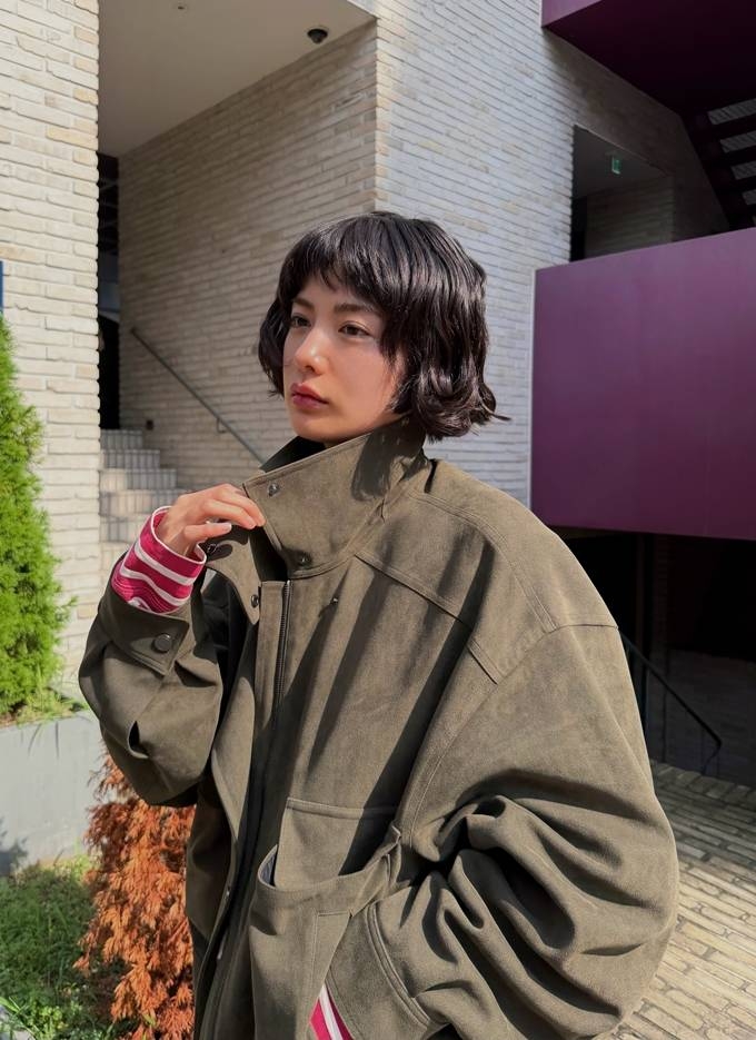 Nana is wearing a high-neck khaki-brown suede jacket. (Instagram)