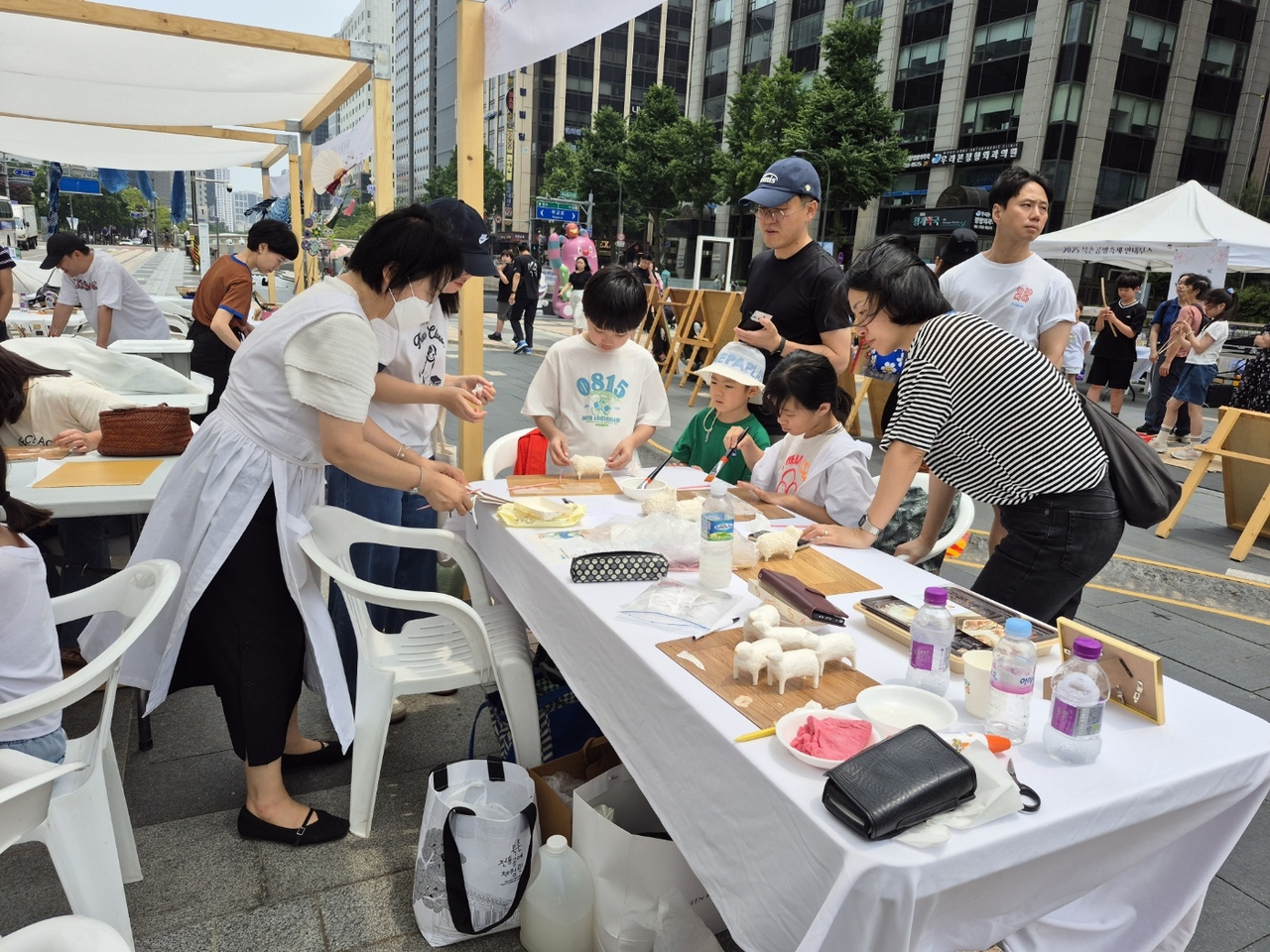 Visitors take part in hands-on craft experiences at the Bukchon workshop festival.
