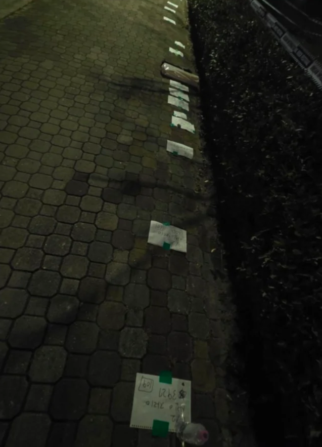 Rows of paper markers used to hold places in line stretch along a walkway leading to the Busan International Rock Festival on Saturday. (Threads)