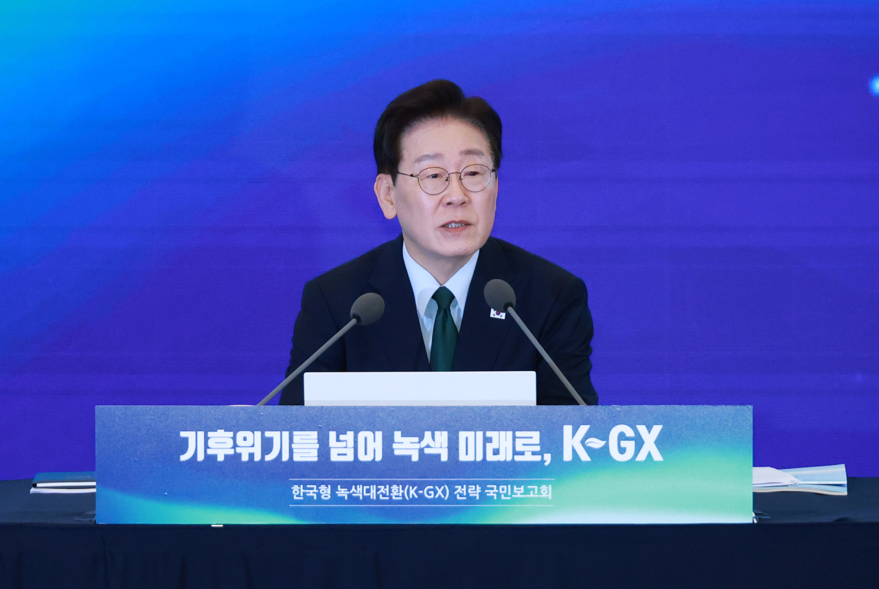 President Lee Jae Myung listens to a presentation during a public briefing on the Korean Green Transformation, or K-GX, strategy in Seoul on Wednesday. (Yonhap)
