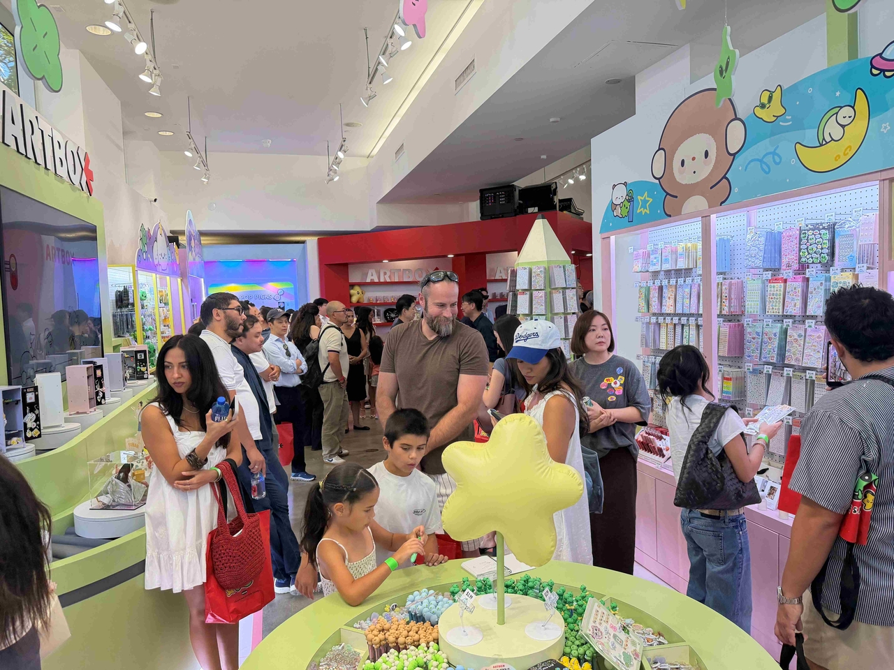 Visitors browse hands-on programs, including diary decorating, at the "2026 Unbox the Fun, Artbox" pop-up store on Melrose Avenue in Los Angeles. [KOTRA]