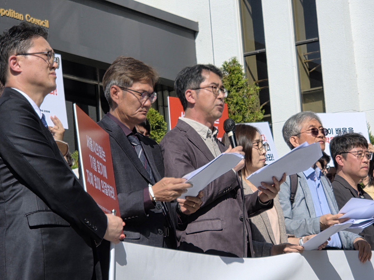 The secretary-general (third from left) of the Nehemiah Church Council civic group speaks during a press conference supporting Yeomyung School in Seoul on Wednesday. (Hwang Sun-jun/The Korea Herald)