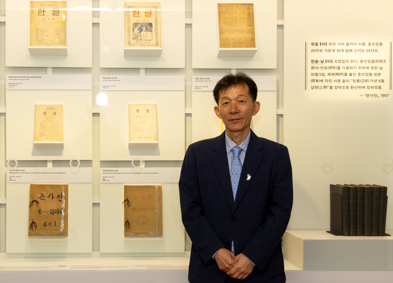 Lim Seong-hwan, director of the National Hangeul Museum, stands in front of museum archives at the "From 1926 to Infinity" exhibition on Oct. 1. (National Hangeul Museum)