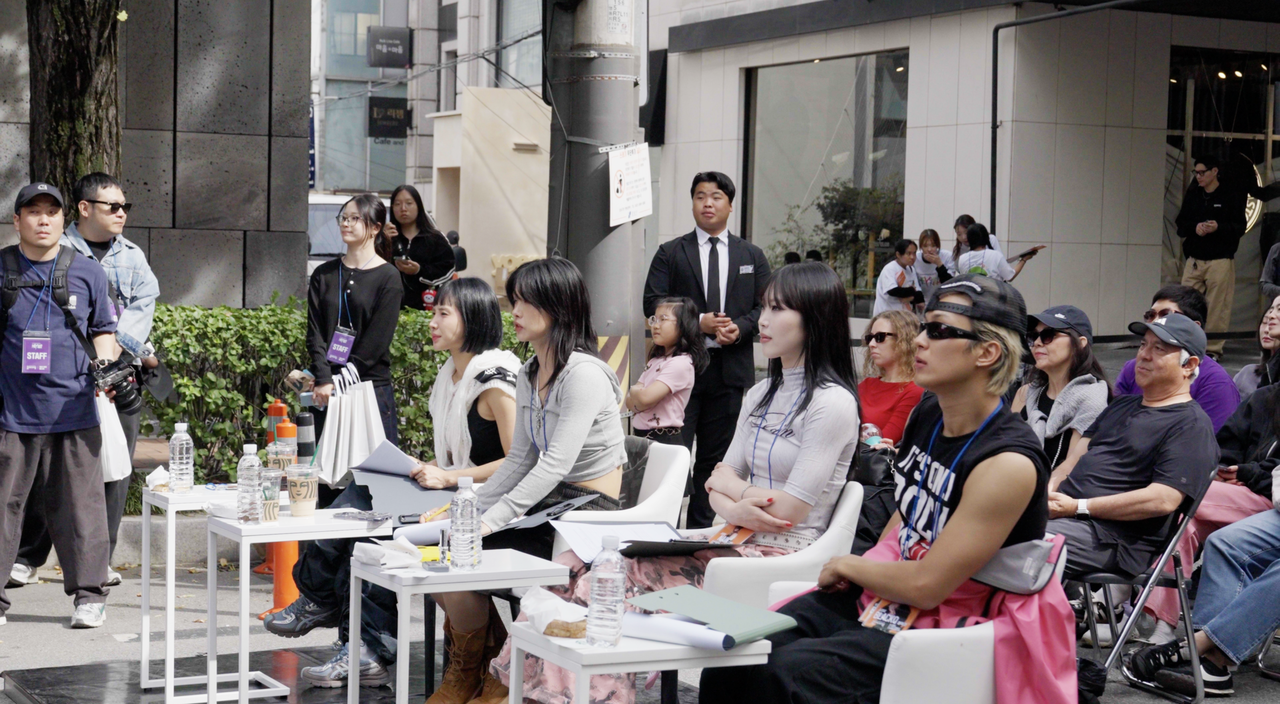From front left: Rian, Aiki, Nain and Black Q judge the Global K-Pop Cover Dance Championship at the Gangnam Festival in Seoul on Oct. 3 (Tammy Park/The Korea Herald)