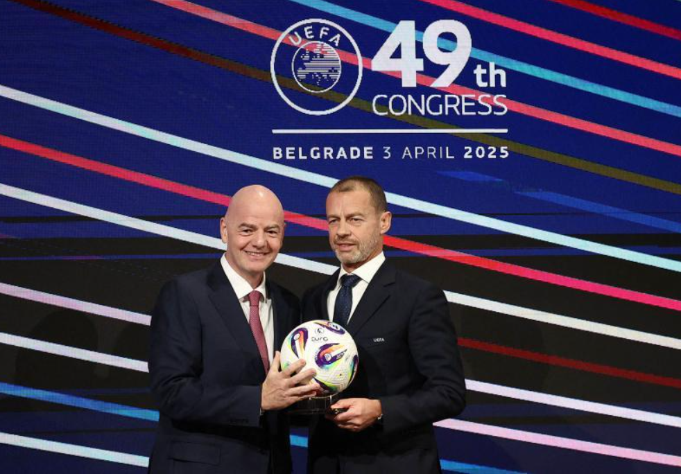 FIFA President Gianni Infantino (left) and UEFA President Aleksander Ceferin hold a ball during the UEFA Congress in Belgrade, Serbia, April 3, 2025.    (AP-Yonhap
