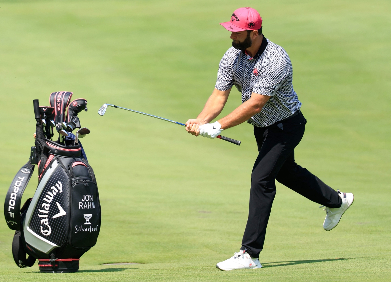 Jon Rahm puts away his club after a shot on the 10th hole during the second round of LIV Golf Indianapolis at The Club at Chatham Hills in Westfield, Indiana, in August. [AFP]