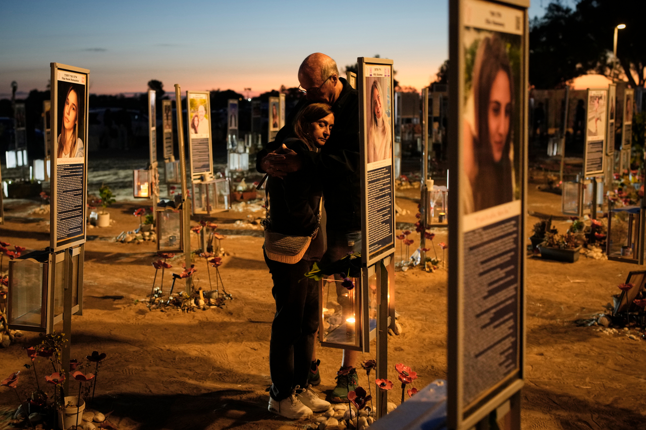 A couple who lost their child during an attack attends a memorial near Kibbutz Reim, southern Israel, Wednesday. (AP-Yonhap)