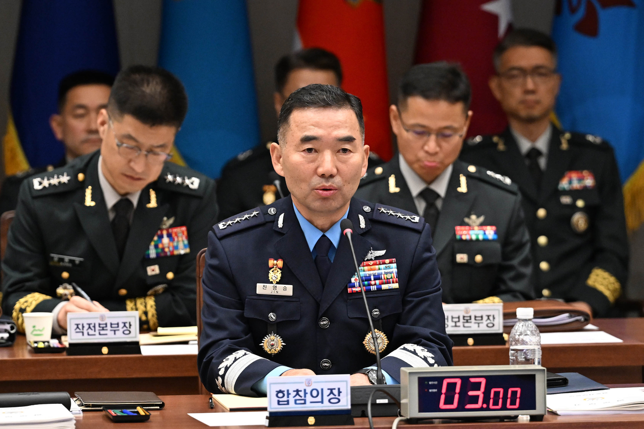 Gen. Jin Yong-sung (front), chairman of the Joint Chiefs of Staff, speaks during a National Assembly audit of the JCS at the Defense Ministry headquarters in Seoul on Thursday. (Joint Press Corps via Yonhap)