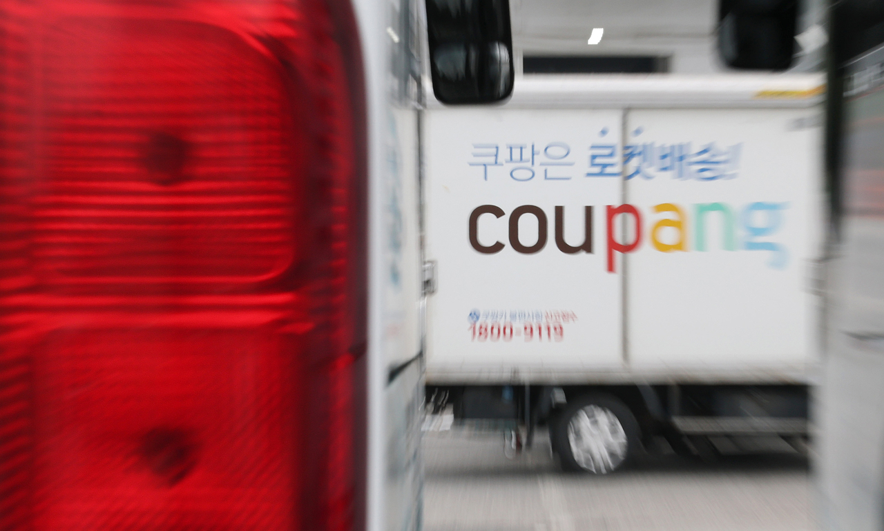This file photo taken on June 11, shows a Coupang delivery truck at a logistics center in Seoul. (Yonhap)