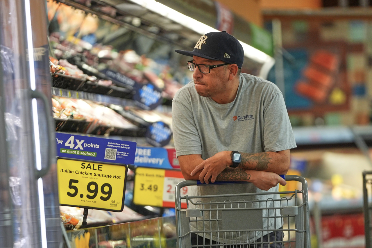 A shopper browses the meat section of a grocery store in Fort Worth, Texas, on Wednesday. [AP]