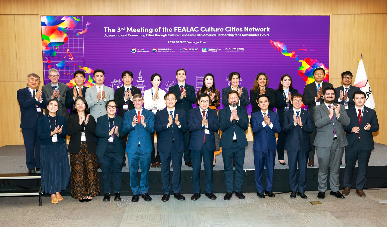 Participants pose for a group photo at the 3rd FEALAC Cultural Cities Network Meeting held at the Hwabaek International Convention Center in Gyeongju on Friday. [Gyeongju City]