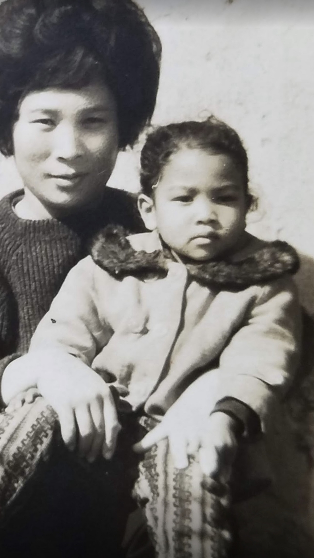 “Relative Strangers” protagonist Lisa Jackson with her Korean birth mother when she was a young girl. (Courtesy of Deann Borshay Liem)