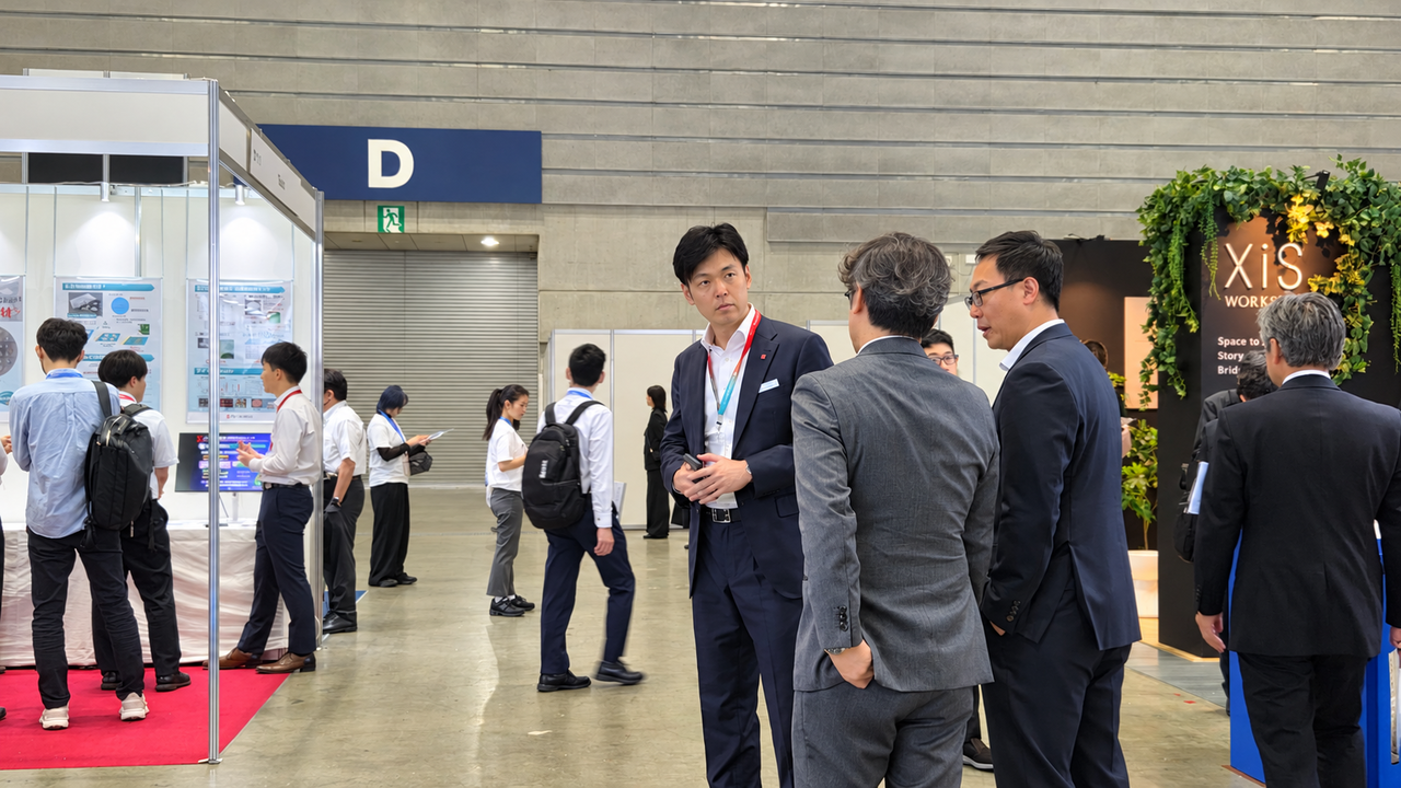 Shin Yu-yeol, co-CEO of Lotte Biologics, speaks with executives at Bio Japan 2026, held at the Pacifico Yokohama Convention Center on Friday.