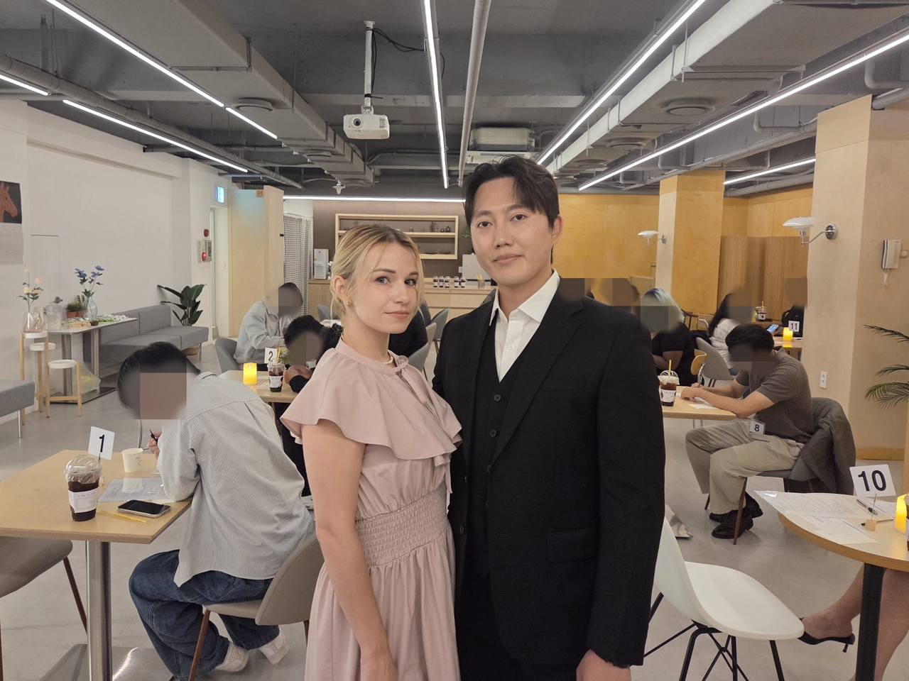 Eom Ji-hun (right) and Rina Chon, the married founders of SoloLink, pose for a photo on Sunday. (Hwang Sun-jun/The Korea Herald)