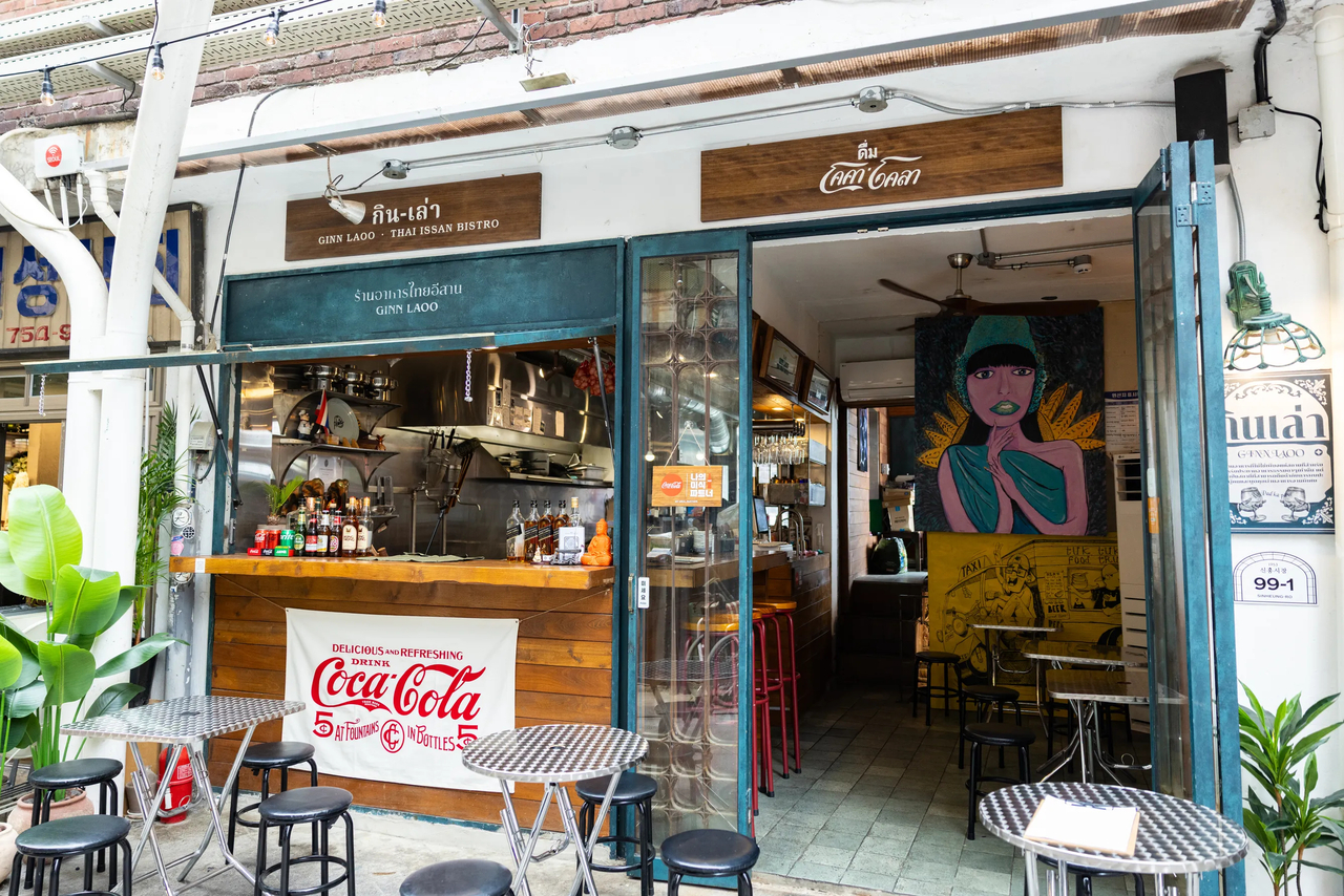 A Coca-Cola sign in Thai outside Ginn Laoo, a Thai restaurant in Sinheung Market. (Coca-Cola)