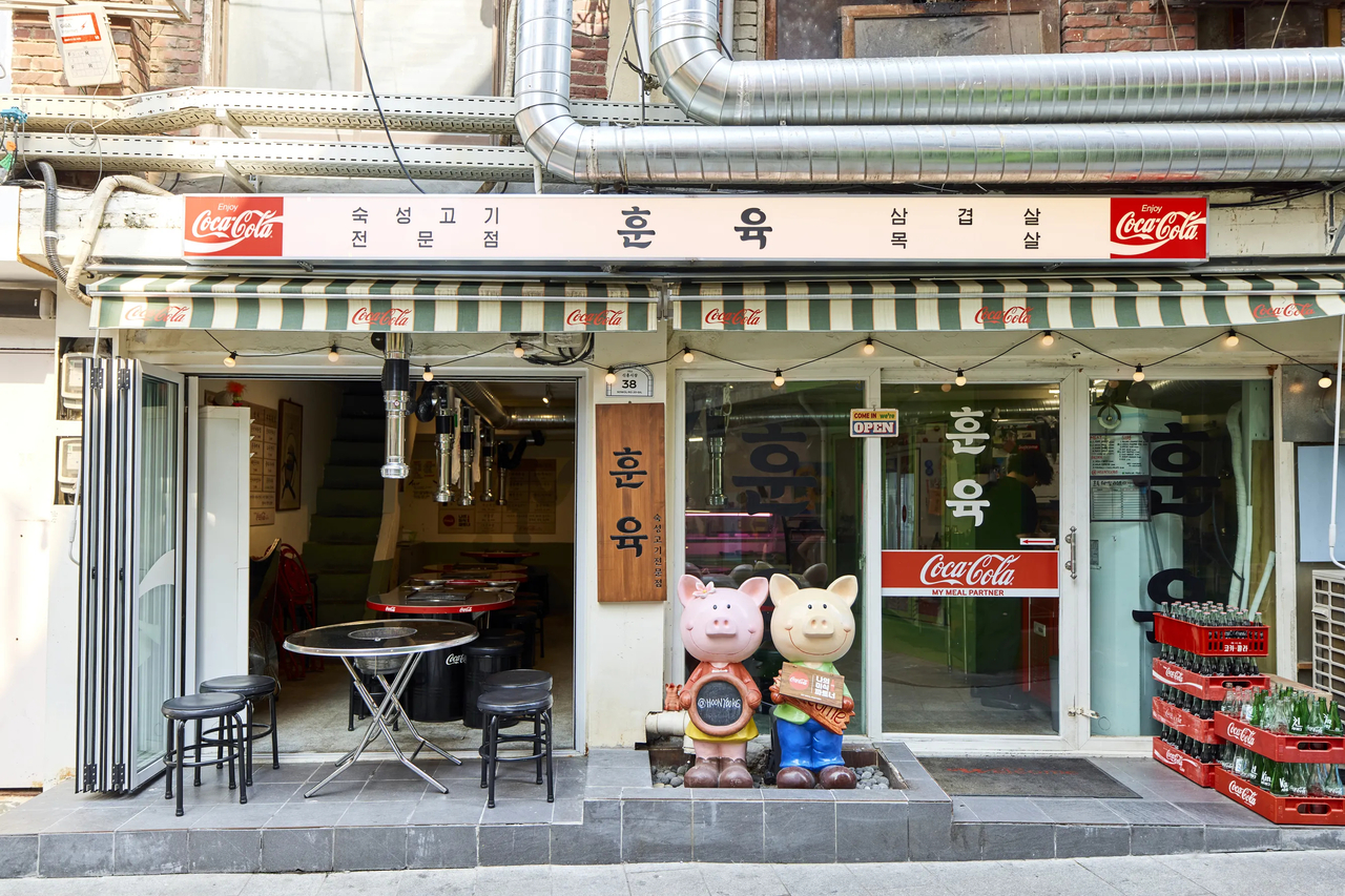 Coca-Cola branding blends into the decor of Hunyuk, a Korean barbecue restaurant in Sinheung Market. (Coca-Cola)