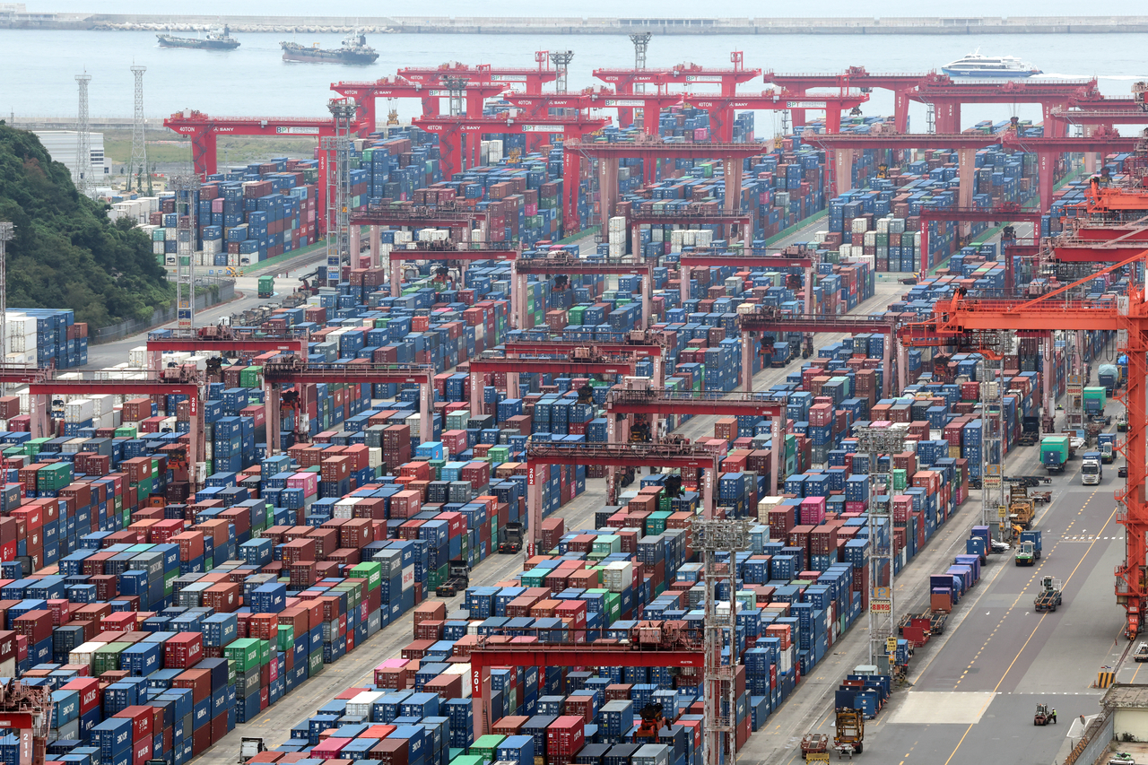 Containers are stacked at a port in Busan on Oct. 1. (Yonhap)