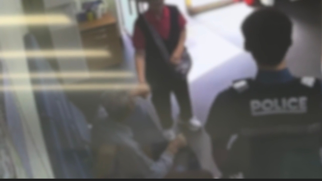 Surveillance footage shows an elderly couple holding hands after being reunited at a police station in Jung-gu, central Seoul, on Sept. 17. (Seoul Metropolitan Police Agency)