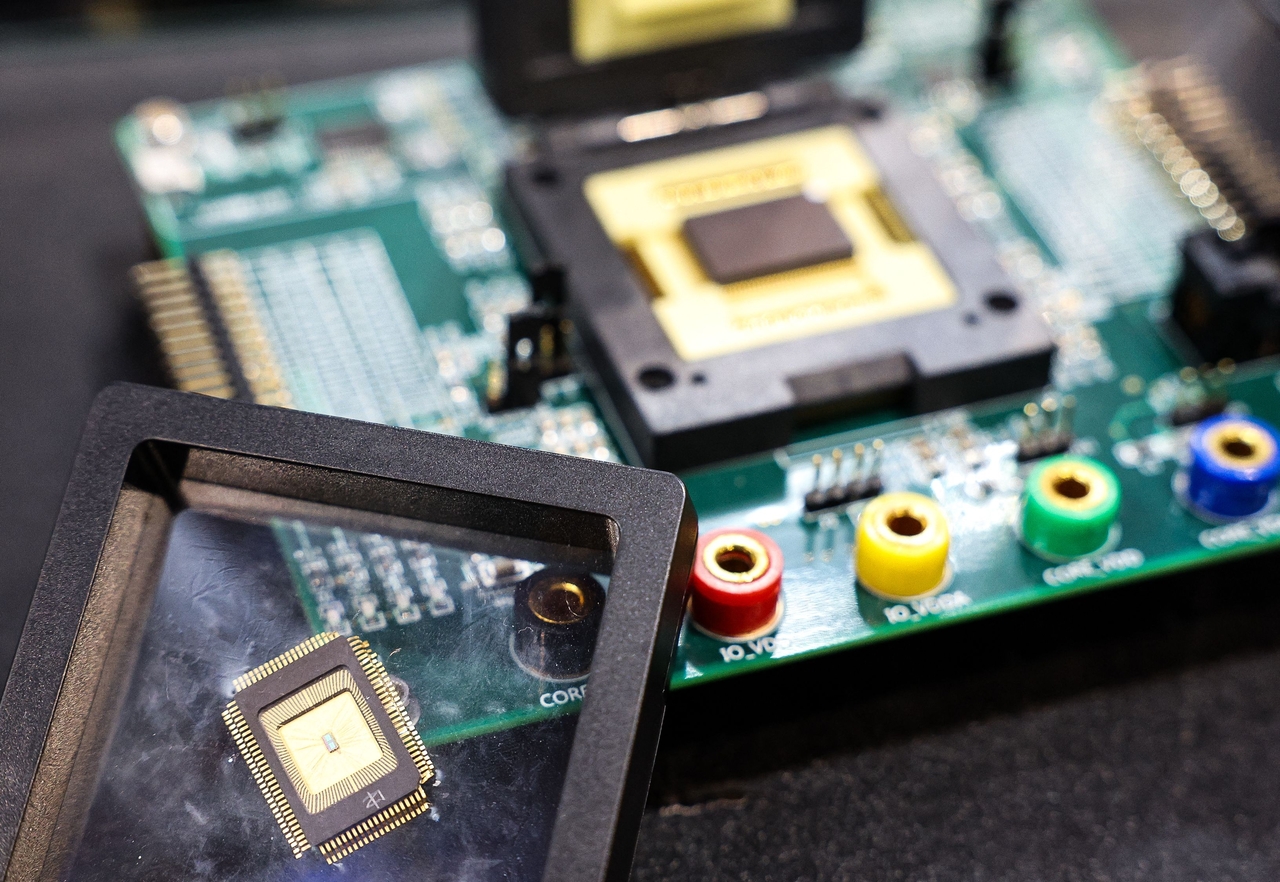 A sample of a semiconductor chip made by Taiwan Semiconductor Manufacturing Company is displayed at the Cybersec 2025 conference and expo in Taipei on April 15, 2025. (AFP-Yonhap)