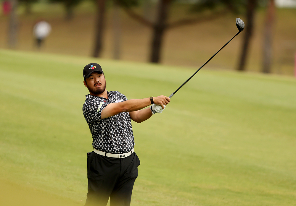 Jung Chan-min plays his second shot on the third hole during the second round of the KPGA Tour's The Charity Classic at Seowon Valley Country Club in Paju, Gyeonggi Province, on Friday.