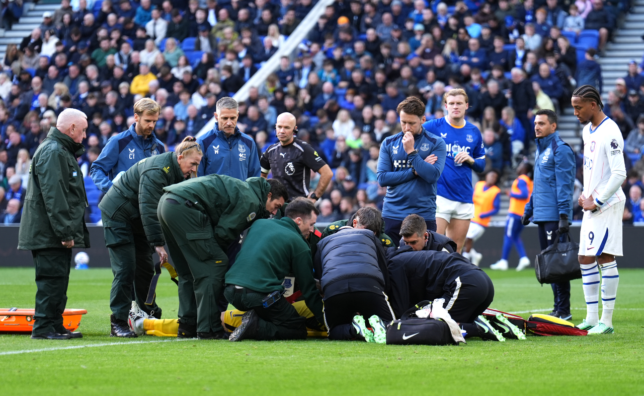 Medics treat Chelsea goalkeeper Emiliano Martinez, in Liverpool, England, Saturday.   (AP-Yonhap)