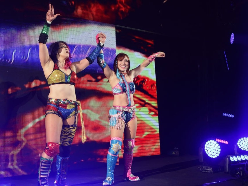 Kairi Sane (right), the Japanese professional wrestler known as the "Pirate Princess," is in talks to join AEW after leaving WWE. [Getty Images]