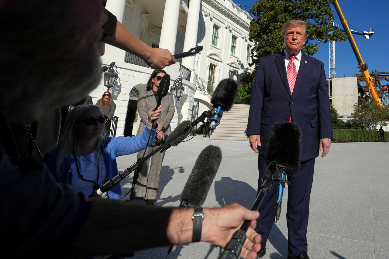 US President Donald Trump speaks with reporters before departing on Marine One from the South Lawn of the White House on Monday, in Washington. (AP-Yonhap)