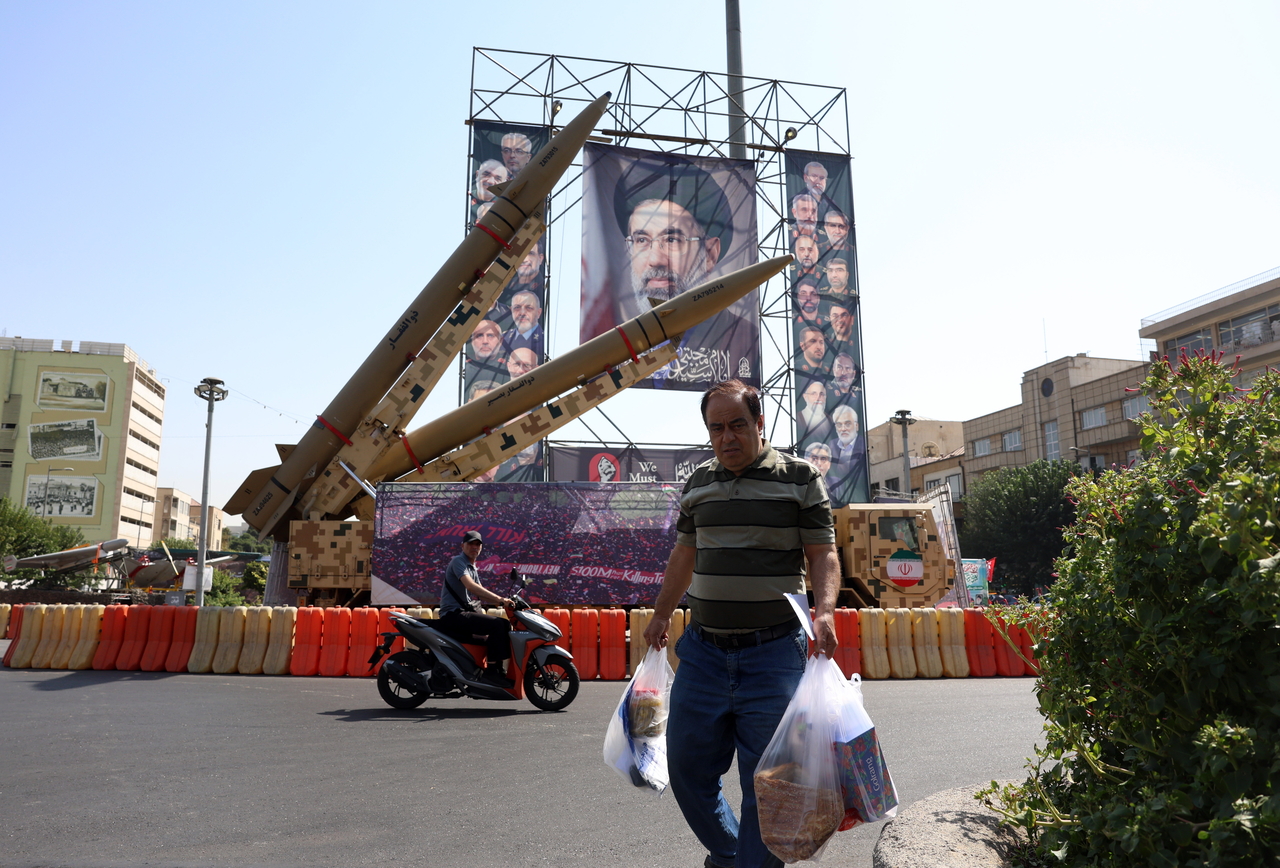 A portrait of Supreme Leader Ayatollah Ali Khamenei and a Zolfaghar missile are displayed at Baharestan Square in central Tehran, Iran. [EPA]