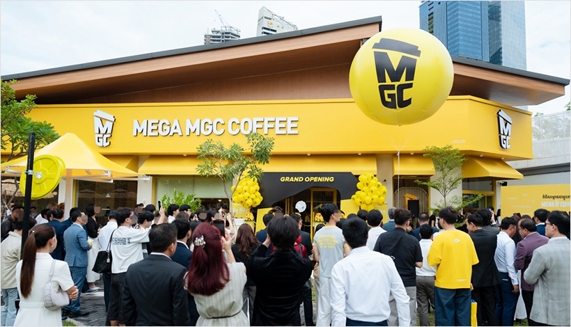 A crowd gathers for the opening of Mega MGC Coffee’s first Cambodian store in Phnom Penh on Oct. 7. (MGC Global)