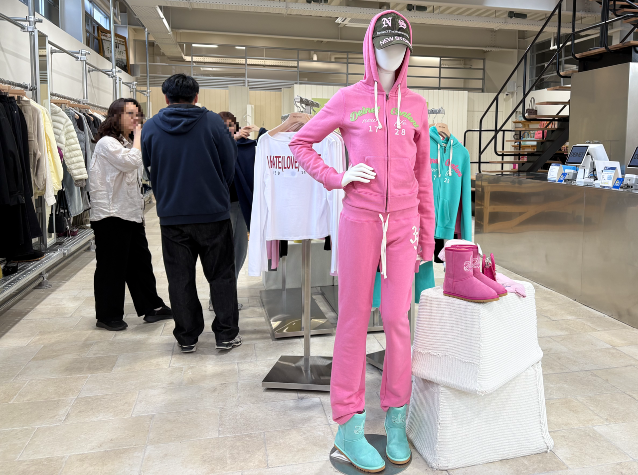 A mannequin at the DEINET flagship store in Seongsu-dong, Seoul, dressed in an exclusively released hooded zip-up and sweatpants alongside the brand's popular UGG boots, photographed Tuesday. (Kang Seung-yeon / The Korea Herald)