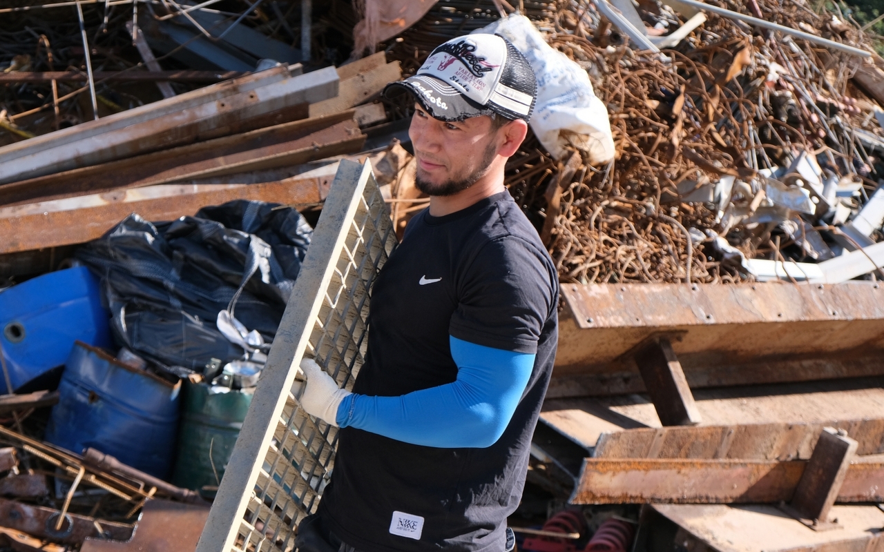 Sardor Abdusatorov at work on a residential demolition site
