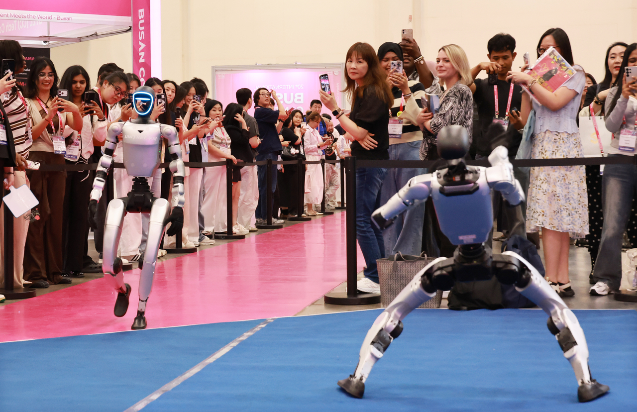 A humanoid robot from Unitree, China's top humanoid robot maker, enters the venue at the 20th Busan Contents Market held at BEXCO in Haeundae-gu, Busan, in June. [Yonhap]
