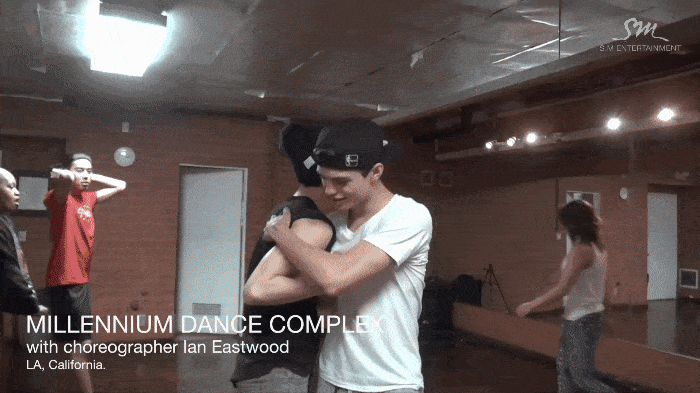 Ian Eastwood teaches Shinee's Taemin the choreography for "Danger" at Millennium Dance Complex in Los Angeles, in footage used for a video that released in 2014. (SM Entertainment)