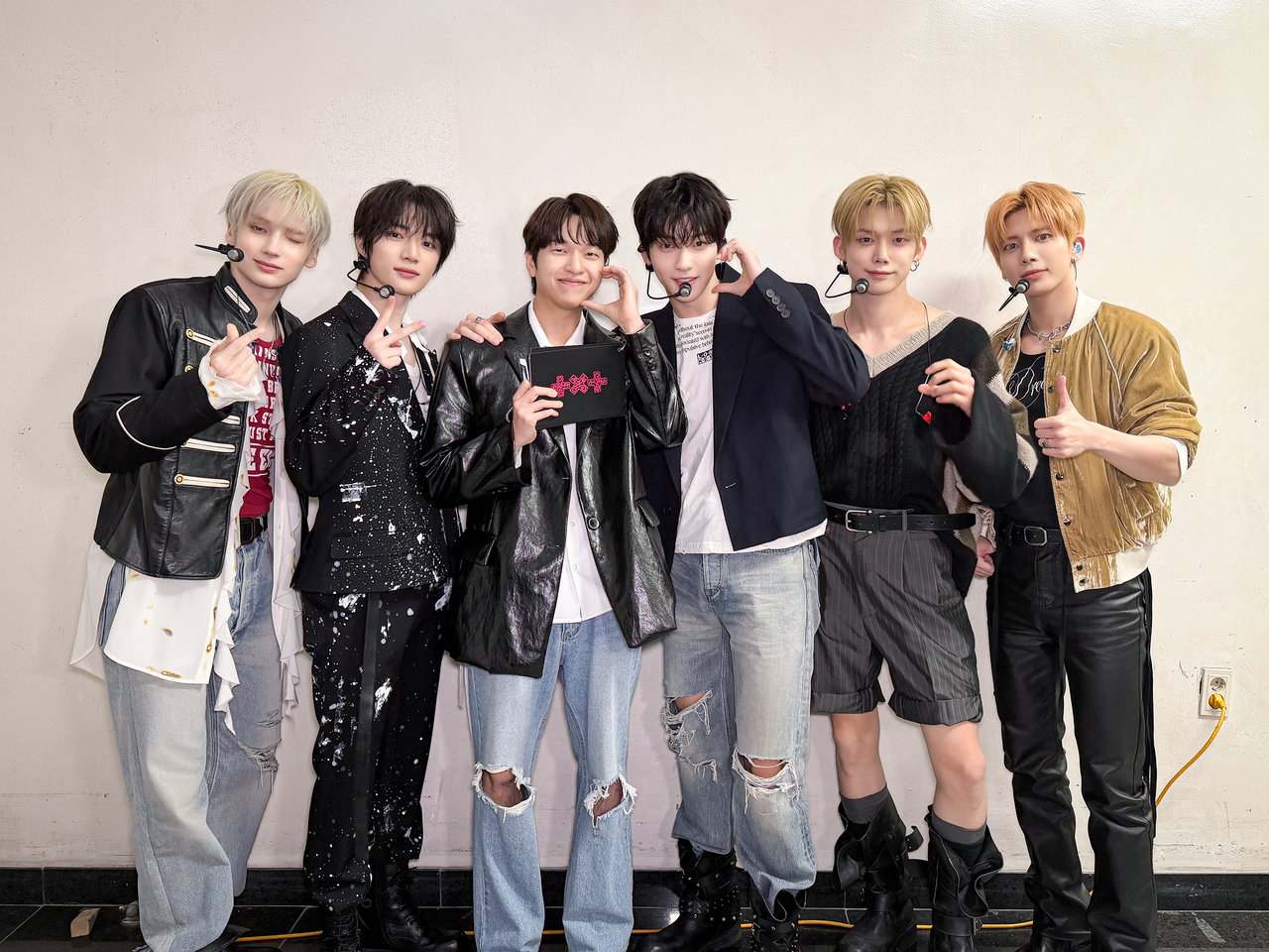 You Jae-phil (third from left) poses with Tomorrow X Together during the group's showcase for its eighth EP, "7th Year: A Moment of Stillness in the Thorns," in Seoul, April 13. (You Jae-phil)