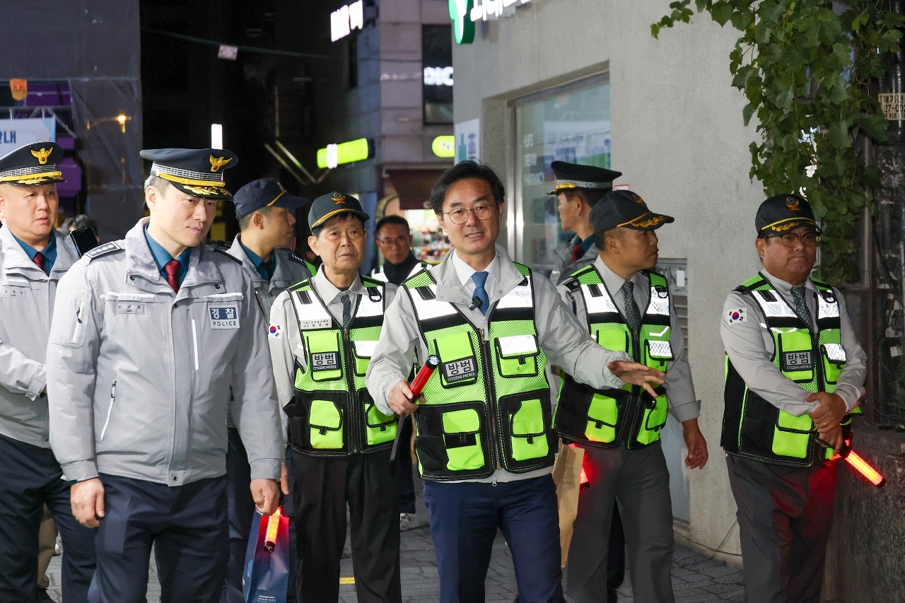 Officers and volunteers conduct a joint patrol.